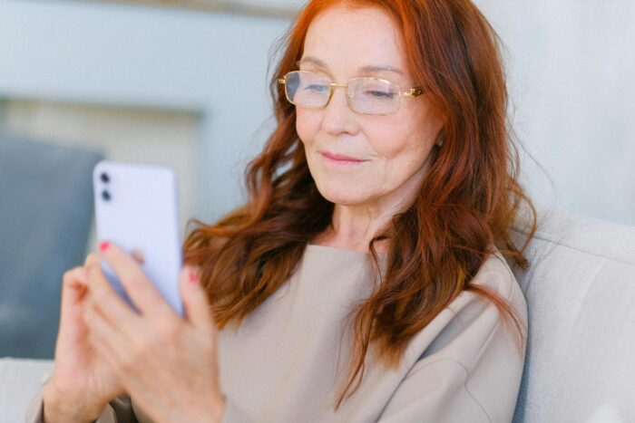 trends in senior living, woman with phone
